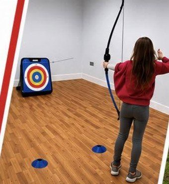 A child trying archery at a SupaFit holiday camp