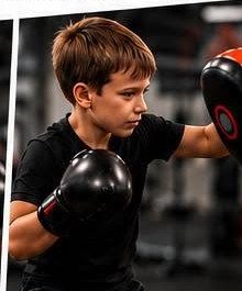 A child doing pad work at a BoxFit Kids session